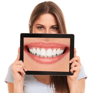 A girl showing her teeth on screen